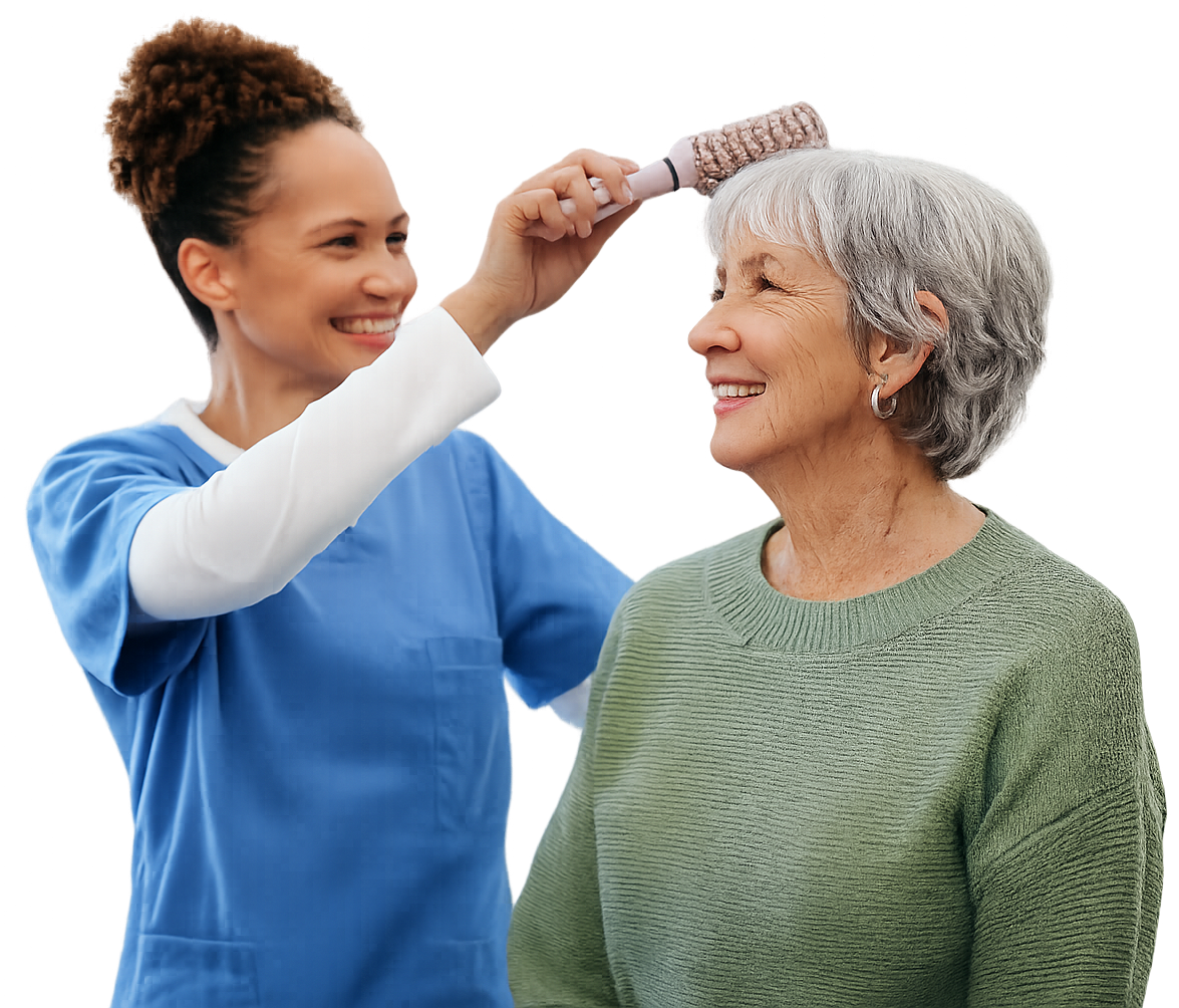 Caregiver brushing elderly woman's gray hair